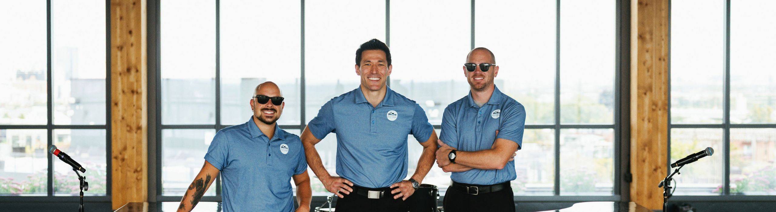 greg and two employees smiling for portrait