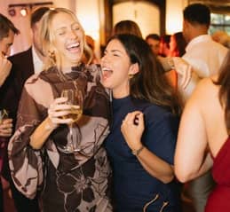 two girls having fun at wedding