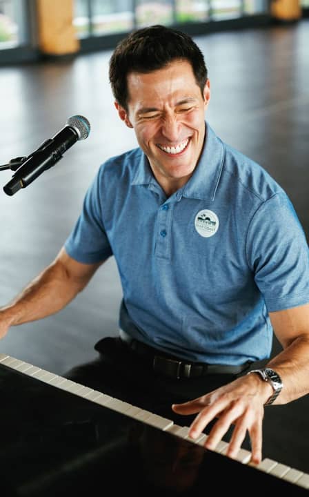 close-up of gentleman playing the piano